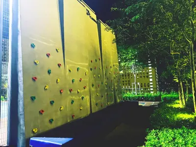 a wall with a climbing wall in a building at World Class Apartment In Georgetown 3BR in Jelutong