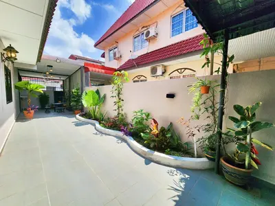 a courtyard of a house with plants in it at IPOH Rainbow Blissful Villa, Persiaran Halaman Ampang Ipoh in Ipoh