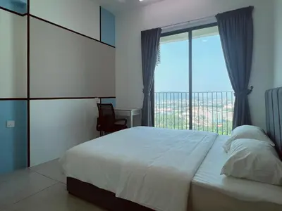 a bedroom with a bed and a large window at Meritus - Perai, Penang in Perai