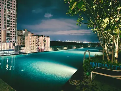 a swimming pool on the roof of a building at Familystay Home 3BR-10PAX in Gua Sai