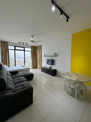 a living room with a couch and a table at Cozy Comfort- Beacon Executives Suite in George Town