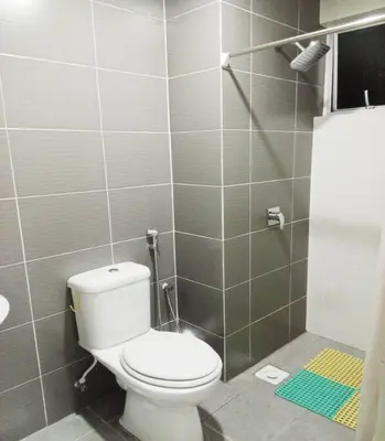 a bathroom with a toilet and a shower at Quintet Cottage in Cameron Highlands