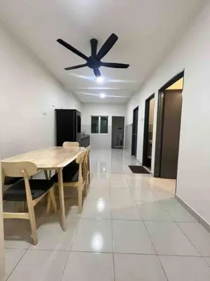 a dining room with a table and a ceiling fan at Homestay Taman Banjar Indah, Teluk Intan in Teluk Intan