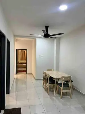 a dining room with a table and a ceiling fan at Homestay Taman Banjar Indah, Teluk Intan in Teluk Intan