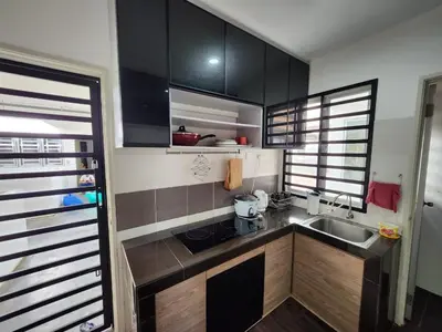 a small kitchen with a sink and a counter top at AYAAN Comfy Homestay with FREE WiFi in Tanah Rata
