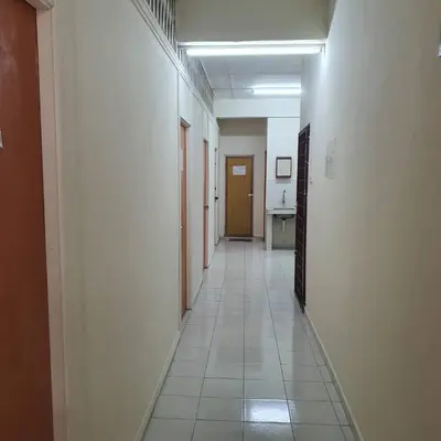an empty hallway with a long hallway with a hallwayngthngthngthngthngthngth at Taman Medan Seri Sentosa, Ayer Tawar in Ayer Tawar