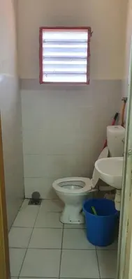a small bathroom with a toilet and a sink at Taman Medan Seri Sentosa, Ayer Tawar in Ayer Tawar