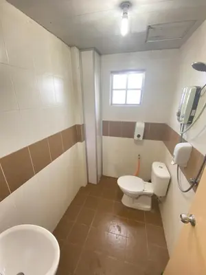 a bathroom with a toilet and a sink at Qaseh Homestay Cameron Highlands 5 in Brinchang