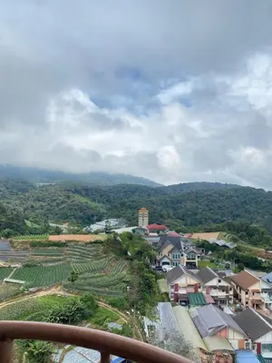 a view of a village with houses and a mountain at Qaseh Homestay Cameron Highlands 5 in Brinchang