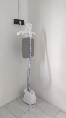 a white shower in a corner of a room at 23 Inn Queenbed Standard Room in Bukit Mertajam