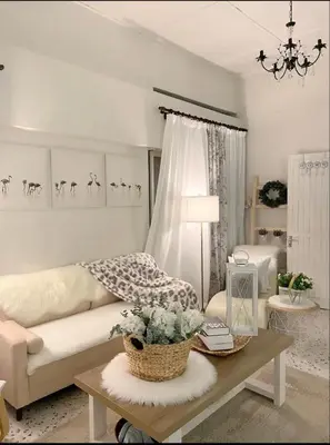 a living room with a couch and a table at Cottage Near Lake Garden in Taiping