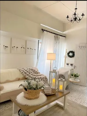 a living room with a couch and a table at Cottage Near Lake Garden in Taiping