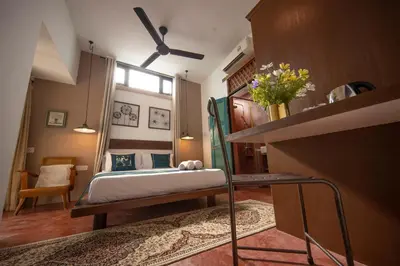a small bedroom with a bed and a window at Sweet Cili Boutique Hotel in George Town
