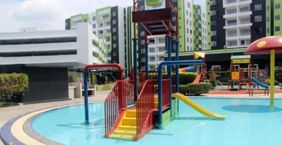 a playground in a city with a slide at Premium Manhattan Ipoh \u6021\u4fdd\u6c11\u5bbf, 4bedroom 12pax, water park in Ipoh