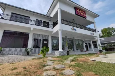 a white building with a sign on it at Grand Aeden Villa in Kuala Kangsar