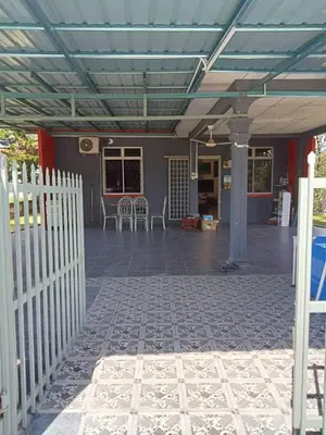 a patio with a white fence and a building at Homestay Mariah in Ipoh