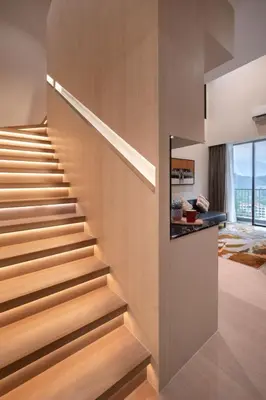 a staircase in a house with wooden walls at Citadines Tanjung Tokong Penang in George Town
