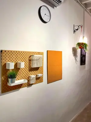 a clock hanging on a wall with towels at Pine Armenian in George Town