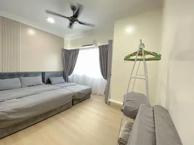 a bedroom with a bed and a ceiling fan at Sekinchan 2008 Home \u60a6\u5ba2 \u76d0\u7cfb\u5976\u5496\u98ce\u6c11\u5bbf in Sekincan