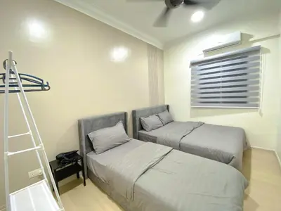 a bedroom with two beds and a ladder in it at Sekinchan 2008 Home \u60a6\u5ba2 \u76d0\u7cfb\u5976\u5496\u98ce\u6c11\u5bbf in Sekincan