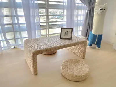 a bench with a picture on it next to a window at Sekinchan 2008 Home \u60a6\u5ba2 \u76d0\u7cfb\u5976\u5496\u98ce\u6c11\u5bbf in Sekincan