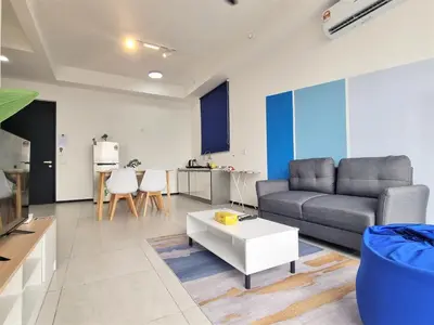 a living room with a couch and a table at Skyblue 2 Rooms Apartment, 4 plus 2 Pax at Urban Suites in Jelutong