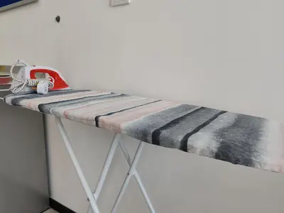 a table with a red machine on top of it at Skyblue 2 Rooms Apartment, 4 plus 2 Pax at Urban Suites in Jelutong