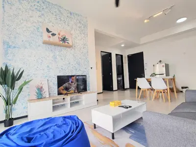a living room with a couch and a tv at Skyblue 2 Rooms Apartment, 4 plus 2 Pax at Urban Suites in Jelutong