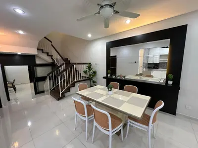 a dining room with a table and chairs and a staircase at Landed House Gelugor 5BR 3B-20pax by 3C in Gelugor