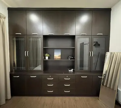 a large brown cabinet in a room at Landed House Gelugor 5BR 3B-20pax by 3C in Gelugor