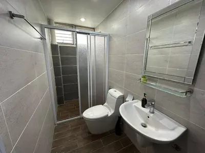 a bathroom with a toilet and a sink and a shower at Landed House Gelugor 5BR 3B-20pax by 3C in Gelugor