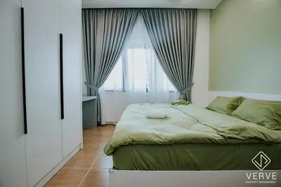 a bedroom with a large bed and a window at Ipoh Mansion House 25 by Verve in Ipoh