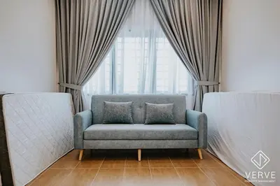 a couch in a room with a large window at Ipoh Mansion House 25 by Verve in Ipoh