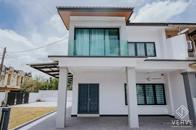 a white house with a balcony on top of it at Ipoh Mansion House 25 by Verve in Ipoh