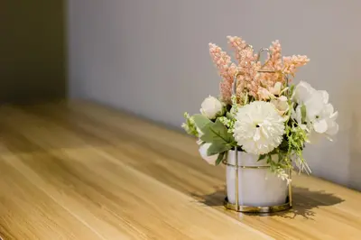 a vase filled with flowers sitting on a table at Urban 10pax Terrace Gem near Sunway Carnival in Perai