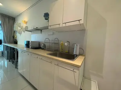 a kitchen with a sink and a counter top at NEW - Panorama Komtar SeaView Meritime Suites in Jelutong