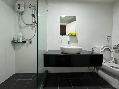 a bathroom with a sink and a shower at NEW - Panorama Komtar SeaView Meritime Suites in Jelutong