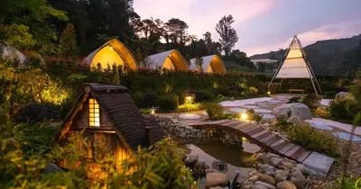 a group of tents in a garden at night at Zen By Stellar Cameron in Brinchang