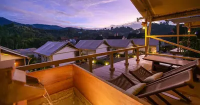 a view from the balcony of a house with a table and chairs at Zen By Stellar Cameron in Brinchang