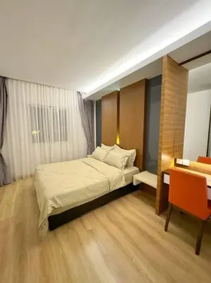 a bedroom with a bed and a table and a desk at TeaValleyView & FarmView - 3BR Cool Summer Cameron in Cameron Highlands