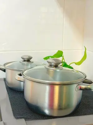 two large pots sitting on a stove in a kitchen at TeaValleyView & FarmView - 3BR Cool Summer Cameron in Cameron Highlands