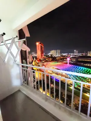a balcony with a view of a city at night at Tur16 SPlCE 10pax 4room Private House in Bayan Lepas