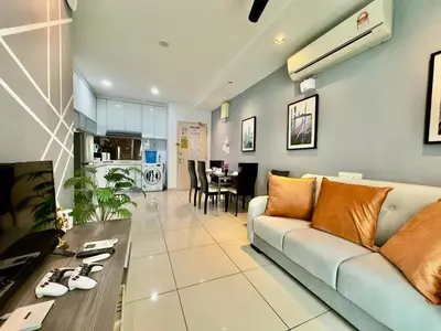 a living room with a couch and a table at Mansion One at Gurney Drive Georgetown by 3C in George Town