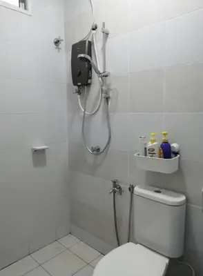 a bathroom with a shower and a toilet in it at 4-Bedroom Homestay in Taiping, Perak in Kamunting