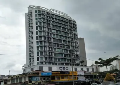 a tall white building with a lot of windows at The CEO Suits in Bayan Lepas