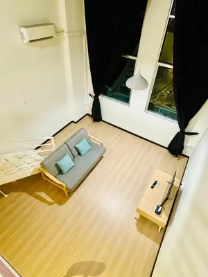 an overhead view of a room with a bed and two pillows at The CEO Suits in Bayan Lepas