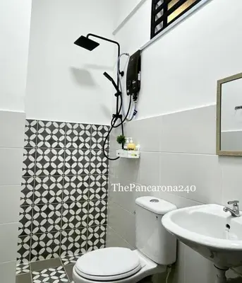 a bathroom with a toilet and a sink at The Pancarona240 in Seri Iskandar