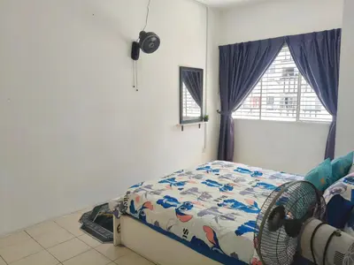 a bedroom with a bed and a window at Ian's Homestay Tanah Rata C Highlands in Tanah Rata