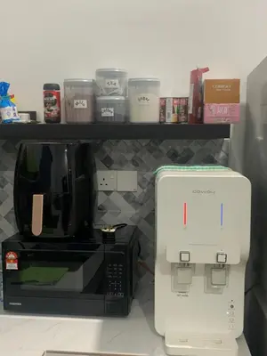 a coffee maker and a coffeemaker on a shelf at HOMeSTAY DAMIA - Islam Homestay Only in Teluk Intan