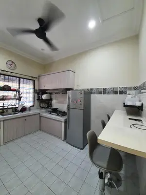a kitchen with a ceiling fan in a kitchen at Teratak Ayuni with Private pool in Batu Gajah